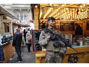 A French soldiers patrols as the Christmas market reopens in Strasbourg, eastern France, Friday, Dec.14, 2018. The man authorities believe killed three people during a rampage near a Christmas market in Strasbourg died Thursday in a shootout with police at the end of a two-day manhunt, French authorities said.