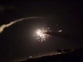 This frame grab from a video provided by the Syrian official news agency SANA shows missiles flying into the sky near Damascus, Syria, Tuesday, Dec. 25, 2018. Israeli warplanes flying over Lebanon fired missiles toward areas near the Syrian capital of Damascus late Tuesday, hitting an arms depot and wounding three soldiers, Syrian state media reported, saying that most of the missiles were shot down by air defense units.