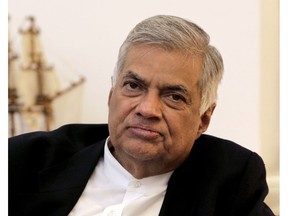 FIEL - In this Nov. 2, 2018, file photo, ousted Sri Lankan Prime Minister Ranil Wickremesinghe listens during an interview with the Associated Press at his official residence in Colombo, Sri Lanka. Sri Lanka's president has reappointed Ranil Wickremesinghe as prime minister, nearly two months after firing him and setting off weeks of political stalemate. Wickremesinghe's United National Party says on its official Twitter account that Wickremesinghe took oath before President Maithripala Sirisena on Sunday, Dec. 16, 2018.