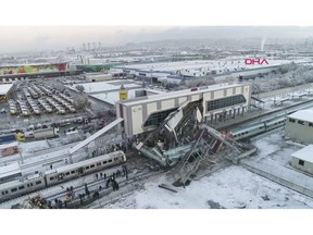 This image made from video shows aftermath of a high-speed train crash at a station in Ankara, Turkey, Thursday, Dec. 13, 2018. The train hit a railway engine and crashed into a pedestrian overpass at the station on Thursday. (DHA via AP)