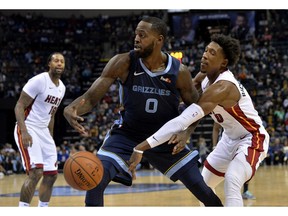 Miami Heat guard Josh Richardson, right, knocks the ball away from Memphis Grizzlies forward JaMychal Green in the second half of an NBA basketball game on Friday, Dec. 14, 2018, in Memphis, Tenn.