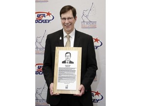 Nashville Predators general manager David Poile poses with his plaque before being inducted into the U.S. Hockey Hall of Fame, Wednesday, Dec. 12, 2018, in Nashville, Tenn.