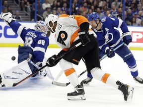 Philadelphia Flyers right wing Wayne Simmonds (17) has his shot stopped by Tampa Bay Lightning goaltender Andrei Vasilevskiy (88) and defenseman Anton Stralman (6) during the first period of an NHL hockey game Thursday, Dec. 27, 2018, in Tampa, Fla.