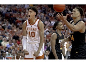 FILE - In this Wednesday, Dec. 5, 2018 file photo, Texas forward Jaxson Hayes (10) celebrates a dunk during an NCAA college basketball game against Virginia Commonwealth in Austin, Texas. Texas freshman Hayes is a meteoric rise from raw talent to early buzz as a potential 2019 NBA draft pick.