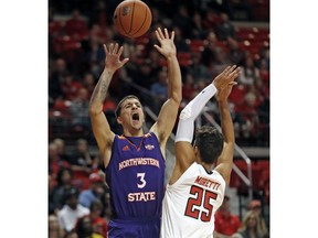 Texas Tech's Davide Moretti (25) breaks up the shot by Northwestern State's Alex Comanita (3) during the first half of an NCAA college basketball game, Wednesday, Dec. 12, 2018, in Lubbock, Texas.