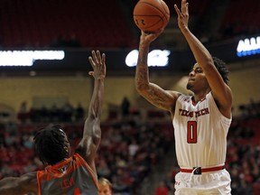 Texas Tech's Kyler Edwards (0) shoots over Texas-Rio Grande Valley's Javon Levi (14) during the first half of an NCAA college basketball game Friday, Dec. 28, 2018, in Lubbock, Texas.