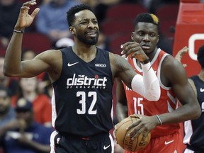 Washington Wizards forward Jeff Green (32) reacts after being called for a foul on Houston Rockets center Clint Capela (15) during the first half of an NBA basketball game, Wednesday, Dec. 19, 2018, in Houston.