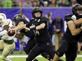 Vanderbilt quarterback Kyle Shurmur (14) passes the ball against Baylor during the first half of the Texas Bowl NCAA college football game Thursday, Dec. 27, 2018, in Houston.