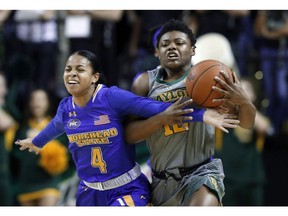 Morehead State's Darianne Seward (4) and Baylor's Moon Ursin, right, struggle to recover a loose ball during the first half of an NCAA college basketball game, Wednesday, Dec. 12, 2018, in Waco, Texas.