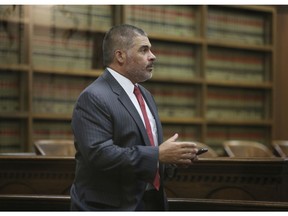In this Oct. 17, 2018 photo, McLennan County District Attorney Abelino Reyna arrives for a hearing in 54th District Court during a hearing in Waco, Texas. Local leaders say a plea deal allowing a former Baylor University fraternity president to serve no jail times highlights the outsized influence alumni play in shaping the criminal justice system in and around Waco. Jacob Walter Anderson was accused of raping a woman outside a 2016 fraternity party. The plea agreement allows him to avoid jail or being listed as a sex offender. The judge, prosecutor and defense attorney in the case all have degrees from Baylor.