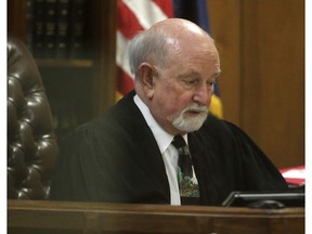 In this Monday, December 10, 2018 photo, 19th State District Court Judge Ralph Strother reads the plea agreement by former Baylor University fraternity president Jacob Anderson in Waco, Texas. Mr. Anderson, accused of rape will serve no jail time after Strother accepted a plea bargain for deferred probation.