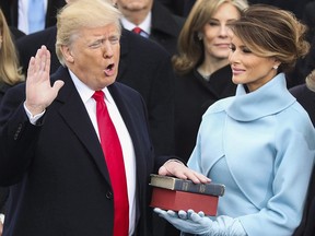 Donald Trump is sworn in as the 45th president of the United States as Melania Trump looks on during the 58th Presidential Inauguration at the U.S. Capitol in Washington on Jan. 20, 2017.