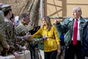 President Donald Trump and first lady Melania Trump greet members of the military at a hanger rally at Al Asad Air Base, Iraq, Dec. 26, 2018.