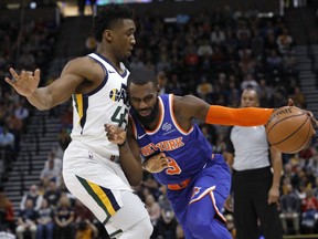 New York Knicks' Tim Hardaway Jr. (3) drives to the basket as he is defended by Utah Jazz's Donovan Mitchell, left, in the first half of an NBA basketball game on Saturday, Dec. 29, 2018, in Salt Lake City.
