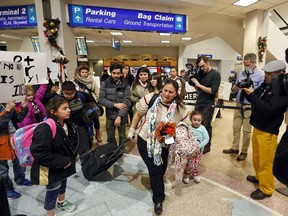FILE - In this Dec. 25, 2017, file photo, Maria Santiago Garcia, and her children walk to the security gate at the Salt Lake City International Airport. Garcia, a Guatemalan woman who was deported from Utah a year ago has since made the decision to send two of her children back to the United States without her.