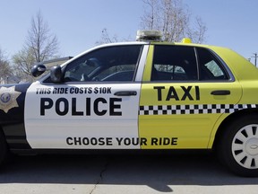 FILE - This March 24, 2017, file photo shows a Woods Cross police vehicle sitting in their parking lot in Woods Cross, Utah. The United States' lowest DUI threshold takes effect this weekend in Utah. Lawmakers in the state approved the 0.05 percent blood-alcohol limit in 2017, and Gov. Gary Herbert signed it into law. The change goes into effect Saturday, Dec. 29, 2018.