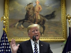 In this Nov. 1, 2018 photo, President Donald Trump talks about immigration and gives an update on border security from the Roosevelt Room of the White House in Washington.