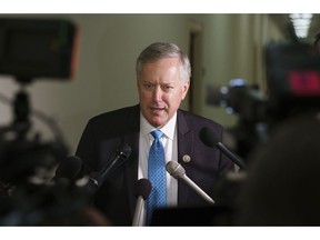 FILE - In this Oct. 25, 2018, file photo, Rep. Mark Meadows, R-N.C., speaks to media on Capitol Hill in Washington. Lawmakers clashed over science, ethics and politics Thursday, Dec. 13, at a House hearing on using fetal tissue in critically important medical research, as the Trump administration reviews the government's ongoing support for such studies. "Most of my constituents don't understand when you harvest baby parts, why that is OK," said Meadows, who chaired the hearing by the Oversight & Government Reform committee.