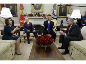 In this Dec. 11, 2018, photo, President Donald Trump and Vice President Mike Pence meet with Senate Minority Leader Chuck Schumer, D-N.Y., and House Minority Leader Nancy Pelosi, D-Calif., in the Oval Office of the White House in Washington. Congress is racing to avoid a partial government shutdown over President Donald Trump's border. But you wouldn't know it by the schedule. Lawmakers are away until next week. The ball is in Trump's court, both sides say.