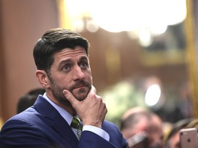 FILE - IN this Nov. 29, 2018, file photo, House Speaker Paul Ryan of Wis., listens during a reception to unveil his portrait on Capitol Hill in Washington. Ryan is bemoaning America's "broken politics" in a farewell speech in which he calls Washington's failure to overhaul costly federal benefit programs "our greatest unfinished business."