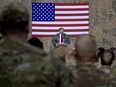 U.S. President Donald Trump speaks to members of the military at a rally at Al Asad Air Base in Iraq on Dec. 26, 2018.