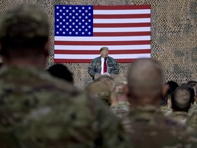 U.S. President Donald Trump speaks to members of the military at a rally at Al Asad Air Base in Iraq on Dec. 26, 2018.