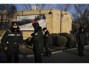Policeman patrol outside the Canadian Embassy in Beijing, Wednesday, Dec. 12, 2018. A Canadian court granted bail on Tuesday to a top Chinese executive arrested at the United States' request in a case that has set off a diplomatic furor among the three countries and complicated high-stakes U.S.-China trade talks.