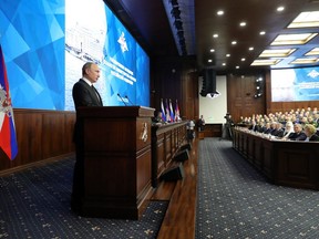 Russian President Vladimir Putin makes an address during a meeting in the Russian Defense Ministry's headquarters in Moscow, Russia, Tuesday, Dec. 18, 2018. Putin said that new Russian weapons have no foreign equivalents, helping ensure the nation's security for decades to come.