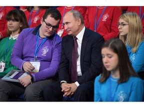 Russian President Vladimir Putin, center, attends a high-tech forum for youth in Yaroslavl, Russia, Thursday, Dec. 13, 2018. Putin said that Russia has a big potential for the development of high-tech industries.