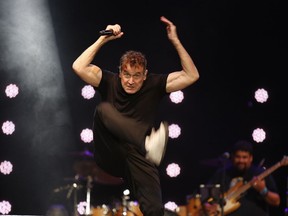 FILE - In this file photo dated Saturday, Nov. 11, 2017, musician Johnny Clegg performs on stage during his own farewell concert in Johannesburg.  The 65-year old Clegg who has survived pancreatic cancer for the last few years, says in an interview broadcast Tuesday Dec. 18, 2018, he has a greater awareness of mortality and enjoys  feeding birds in his garden.