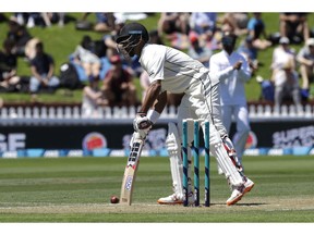 New Zealand's Jeet Raval stops the ball while batting during play on day two of the first cricket test between New Zealand and Sri Lanka in Wellington, New Zealand, Sunday, Dec. 16, 2018.