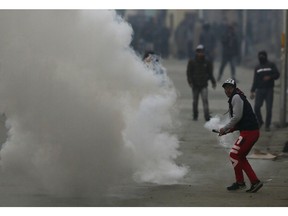 Kashmiri protesters clash with Indian paramilitary soldiers in Srinagar, Indian controlled Kashmir, Sunday, Dec. 16, 2018. A security clampdown and a strike sponsored by separatists fighting against Indian rule shut most of Indian-administered Kashmir on Sunday, a day after chaotic protests and fighting killed seven civilians and four combatants in the disputed region.