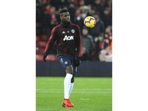 Manchester United's Paul Pogba warms up prior to the English Premier League soccer match between Liverpool and Manchester United at Anfield in Liverpool, England, Sunday, Dec. 16, 2018.