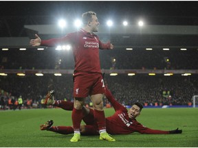 Liverpool's Xherdan Shaqiri celebrates after scoring his side's second goal during the English Premier League soccer match between Liverpool and Manchester United at Anfield in Liverpool, England, Sunday, Dec. 16, 2018.