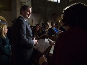 Leader of the Opposition Andrew Scheer speaks with the reporters as Conservative MP Michelle Rempel (left) looks on following Question Period in Ottawa, Tuesday December 4, 2018.