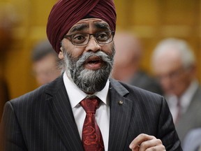 Minister of National Defence Minister Harjit Sajjan rises during question period in the House of Commons on Parliament Hill in Ottawa on Tuesday, Dec.4, 2018.