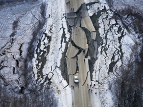 This Nov. 30, 2018 file aerial photo shows earthquake damage on Vine Road, south of Wasilla, Alaska.