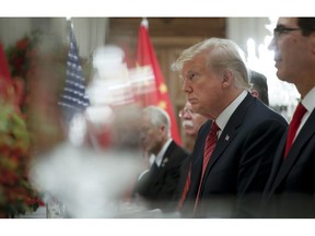 President Donald Trump listens to China's President Xi Jinping speak during their bilateral meeting at the G20 Summit, Saturday, Dec. 1, 2018 in Buenos Aires, Argentina.