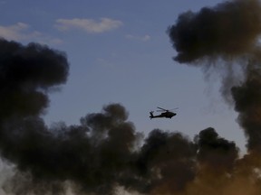 Israeli military digger works on the border with Lebanon in the northern Israeli town of Metula, Tuesday, Dec. 4, 2018. The Israeli military launched an operation on Tuesday to "expose and thwart" tunnels built by the Hezbollah militant group it says stretch from Lebanon into northern Israel.