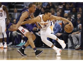 Phoenix Suns guard Elie Okobo (2) loses the ball during the first half of an NBA basketball game against the Los Angeles Clippers, Monday, Dec. 10, 2018, in Phoenix.