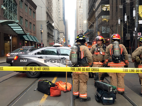 Emergency responders block the road after a bomb threat evacuated the King Street subway station in downtown Toronto, Dec. 13, 2018.