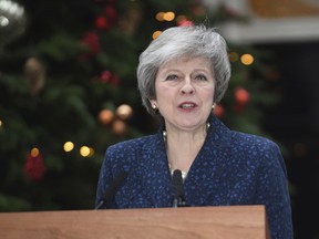 Britain's Prime Minister Theresa May makes a media statement in Downing Street, London, confirming there will be a vote of confidence in her leadership of the Conservative Party, Wednesday Dec. 12, 2018.