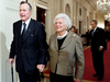 Former President George H. W. Bush, left, walks with his wife, former first lady Barbara Bush, followed by their son, President George W. Bush, and his wife first lady Laura Bush, Jan. 7, 2009.