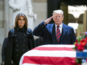 U.S. President Donald Trump and first lady Melania Trump pay their respects in the U.S. Capitol Rotunda where former U.S. President George H.W. Bush lies in state Dec. 3, 2018 in Washington.