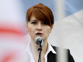 In this April 21, 2013, file photo, Maria Butina, leader of a pro-gun organization in Russia, speaks to a crowd during a rally in support of legalizing the possession of handguns in Moscow, Russia.