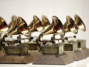 FILE - In this Oct. 10, 2017, file photo, various Grammy Awards are displayed at the Grammy Museum Experience at Prudential Center in Newark, N.J. Nominations for the 61st annual Grammy Awards will be announced Friday morning, Dec. 7, 2018. The Recording Academy delayed unveiling the nominees by two days because former President George H.W. Bush's funeral and public viewing this week in Washington.