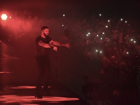 FILE- In this Oct. 12, 2018, file photo Drake performs at the Staples Center in Los Angeles. A list of nominees in the top categories at the 2019 Grammys, including Kendrick Lamar, who is the leader with eight nominations, were announced Friday, Dec. 7, 2018, by the Recording Academy. Drake, Cardi B, Brandi Carlile, Childish Gambino, H.E.R., Lady Gaga, Maren Morris, SZA, Kacey Musgraves and Greta Van Fleet also scored multiple nominations.