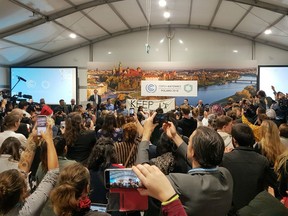 Youth and indigenous groups protest against fossil fuels during US-hosted event at the UN climate talks in Katowice, Poland, Monday, Dec. 10, 2018, as the COP24 UN Climate Change Conference takes place in the city.