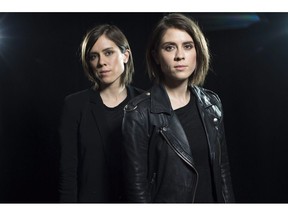 Sara Quin, left, and Tegan Quin, of the Canadian singing duo Tegan and Sara, pose for a portrait in New York on May 12, 2016. Pop twins Tegan and Sara Quin are set to release a memoir in September 2019. The memoir, "High School," to be published by Simon & Schuster, will reflect on the Quins' upbringing in Calgary amid the grunge culture of the 1990s.