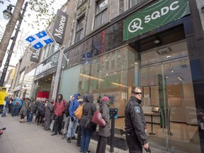 Customers lineup at a government cannabis store in Montreal on October 18, 2018. The Quebec government tabled legislation this morning that would raise the legal age for consuming cannabis in the province to 21. Bill 2 would also prohibit cannabis consumption in all public places, including parks and streets.